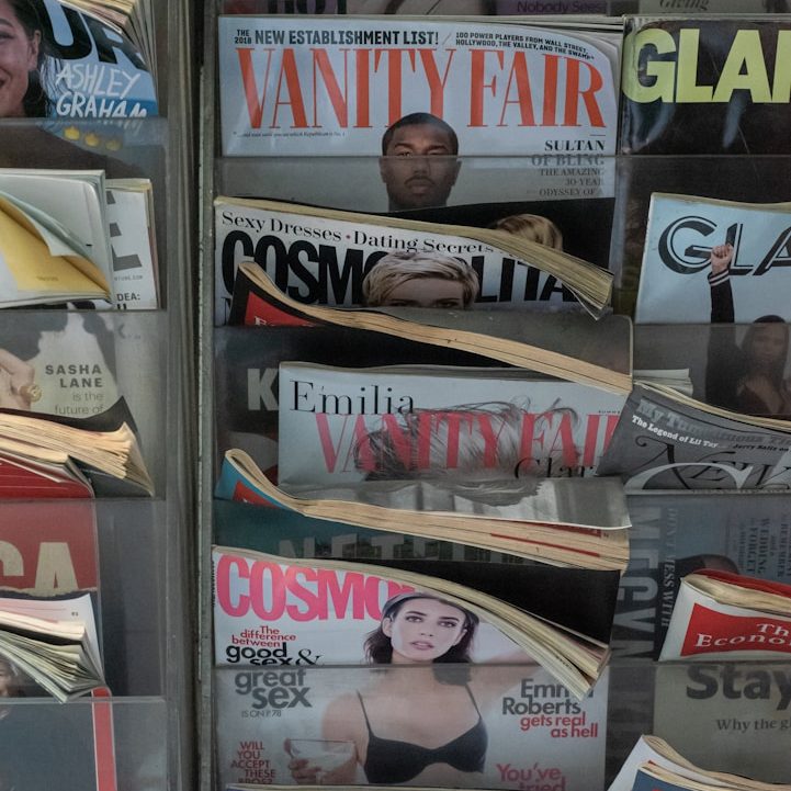 Stack of health and lifestyle magazines representing Shani Shaker’s media expertise in health, wellness, and nutrition communications
